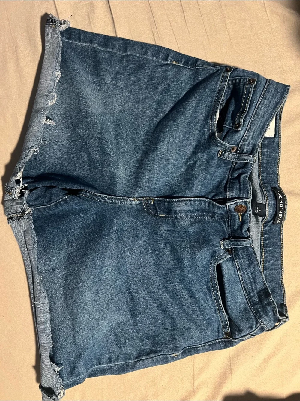 Calvin Klein Jeans Distressed Denim Shorts in Medium Blue